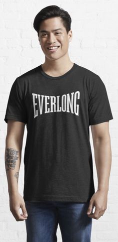 a man wearing a black t - shirt with the word everlong printed on it