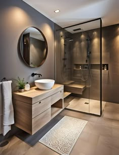 a bathroom with a sink, mirror and stand up shower in the middle of it