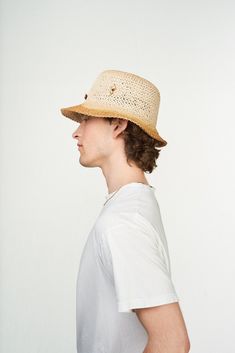 This stylish CROCHET KHOYA unisex bucket hat is crafted with natural raffia, featuring a subtle orange logo and decorated with gold-plated metal accessories and hand-assembled pearl accents in brown and yellow. Each hat is made with precision in Florence and completed with artistry in Stockholm. Raffia Crochet, Stylish Crochet, Pearl Accessories, Orange Logo, Metal Accessories, Hat Sizes, Stockholm, Florence, Eyebrows