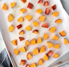 chopped up sweet potatoes on a cutting board