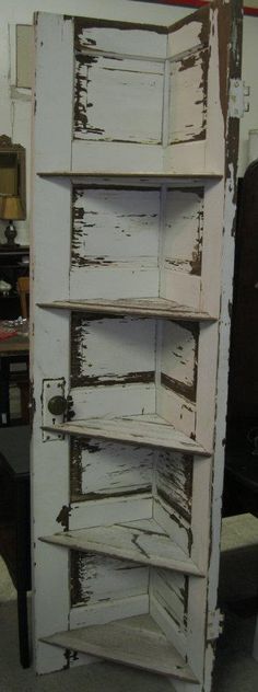 an old white cabinet with lots of drawers