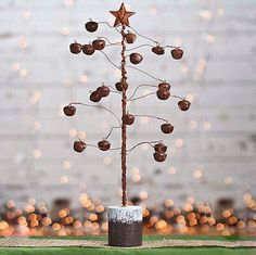 a small tree made out of branches and nuts