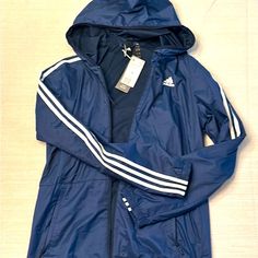 Adidas Wind Jacket, Size M Nwt. Blue Adidas Windbreaker For Sports, Blue Adidas Sports Windbreaker, Blue Adidas Outerwear For Outdoor, Blue Adidas Sporty Windbreaker, Adidas Blue Outdoor Outerwear, Adidas Blue Sporty Windbreaker, Sporty Blue Adidas Windbreaker, Blue Adidas Windbreaker For Spring, Adidas Blue Windbreaker For Spring