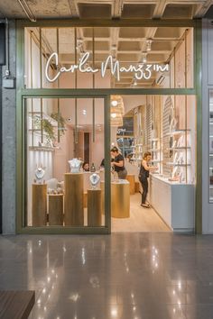 the inside of a store with glass doors