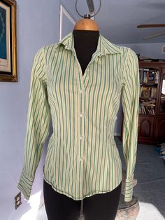 "Vintage mens' style shirt for woman, great fit spandex 3%, cotton 97% washable. please look at the princess cut style, very flattering! US Size M please check measurements below: SHOULDERS: 14.5\" BUST: 36\" WAIST: 29-31\" SLEEVES LENGHT: 23. 3/4\" LENGHT: 24\" FINAL SALE, NO RETURNS, NO EXCHANGES PLEASE CONTACT FOR ANY QUESTIONS OR CONCERNS." Stretch Cotton Long Sleeve Shirt, Vertical Striped Fitted Tops, Spring Green Shirt With Vertical Stripes, Green Long Sleeve Shirt With Striped Collar, Green Vertical Stripes Shirt For Spring, Fitted Shirt With Striped Collar For Spring, Green Slim Fit Cotton Tops, Green Stretch Long Sleeve Shirt, Green Stretch Cotton Shirt