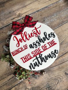 a christmas ornament that reads, jolliest bunch of wishes this side of the nuthouse