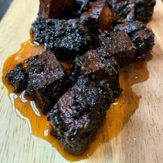 some food is sitting on a cutting board and ready to be cut into cubes