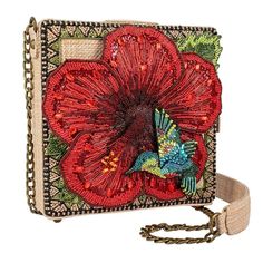 "Mary Frances Meet Me in the Tropics Crossbody Handbag New With Tags Truly a vision of paradise! An intricately beaded 3D Hibiscus flower and colorful hummingbird make this beaded bag a gorgeous display piece and the padded-shoulder crossbody strap ensures it's comfortable to carry around with you all day. 7 x 2.25 x 7.5\" Strap Length End to End: 48\" Strap Drop: 23\" Non-removable padded-shoulder crossbody strap, magnet flap closure, inside slip pocket, fits a cell phone UPC 634010011277 Dust Colorful Hummingbird, Mary Frances Bags, Mary Frances Handbags, Mary Frances, Crossbody Bags For Travel, Beaded Handbag, A Cell, Creative Colour, Crossbody Clutch