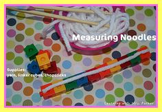 some toys are laying on a polka dot tablecloth with the words measuring noodles written above them