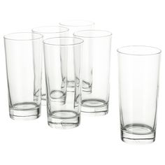 a set of six glasses sitting next to each other