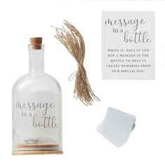 a message in a bottle next to some paper and twine on a white background