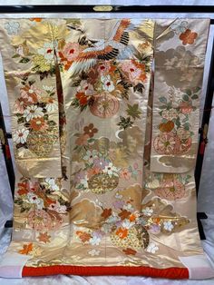 A gold Japanese wedding Uchikake for your special day.  Celebrate your special day in this beautiful Kimono robe. Vintage Japanese Kimonos are a unique and stunning piece of Japanese culture. Kimono's are made completely by hand and are considered a wearable work of art. Item: Uchikake Kimono Japanese Wedding Robe No. yukn357 Size: US  Large / Length 74 inch (189cm), Width 25.9 inch (66cm). Condition: Used, Good. Please check the photos. Shop the entire collection https://fujiyamarock.etsy.com S Elegant Gold Kimono For Wedding, Traditional Gold Ceremonial Kimono, Traditional Gold Kimono For Wedding, Traditional White Kimono For Wedding, Elegant Gold Kimono For Ceremonial Occasions, Beautiful Kimono, Kimono Japanese, Japanese Wedding, White Kimono