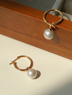 Experience elegant simplicity with our Baroque Pearl Drop Hoop Earrings. The near-round pearls add sophistication and versatility to any look. Celebrate the allure of natural beauty with their unique and exquisite form. Make a statement with these timeless, modern earrings. Metal: 18K Recycled Gold Plated On Brass Gemstone: Freshwater Pearl Pearl Dimensions: 11-11.5mm Dimensions: 3.5cm Weight: Single 3.5g Minimalist Yellow Gold Pearl Hoop Earrings, Gold Hoop Pearl Earrings In Minimalist Style, Gold Hoop Pearl Earrings Minimalist Style, Minimalist Formal Hoop Earrings With Pearl Drop, Yellow Gold Hoop Earrings With Pearl Pendant, Minimalist Hoop Pearl Earrings For Formal Occasions, Formal Minimalist Hoop Earrings With Pearl Drop, Minimalist Hoop Earrings With Pearl Chain, Formal Minimalist Hoop Pearl Earrings