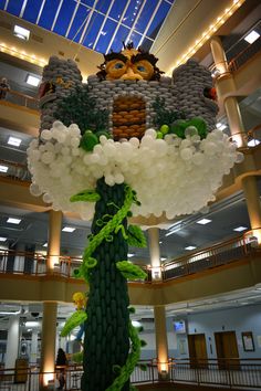 a large balloon sculpture in the middle of a building