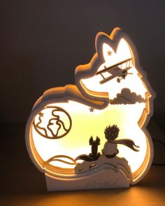 a lit up sign with an image of a cat and dog in the sky on it