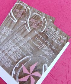 an open magazine with the names and numbers of various items on it, sitting on a pink surface