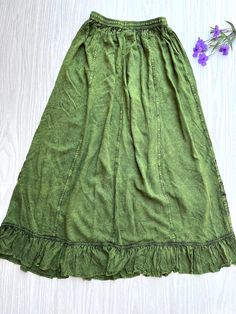 Introducing our Pari Vintage Vibe Green Embroidery Maxi Skirt, perfect for embracing those boho and hippie vibes! This stunning skirt features pleated borders that add a touch of elegance, while the maxi length offers a chic and comfortable fit.Crafted with fairly-core fashion inspiration, this skirt is ideal for creating enchanting cottage-core looks. Whether you're strolling along sandy shores or exploring hidden getaways, this skirt will ensure you're dressed to impress. Its flowing silhouette captures the essence of fairy-core aesthetics, evoking a sense of whimsy and magic.Designed for the boho fashionista in you, it is versatile and easy to style. Pair it with a cropped top and woven sandals for a carefree bohemian look, or opt for a lace blouse and floppy hat for a more sophisticate Bohemian Gathered Skirt For Summer, Hippie Spring Flowy Maxi Dress, Spring Hippie Flowy Maxi Dress, Spring Hippie Maxi Dress With Flowy Skirt, Hippie Style Flowy Maxi Dress For Spring, Flowy Ruffled Festival Bottoms, Spring Bohemian Maxi Dress With Lined Skirt, Flowy Ruffled Skirt Bottoms For Festival, Spring Festival Bottoms With Gathered Skirt