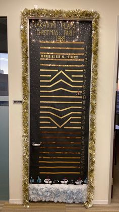 a door decorated with christmas lights and garlands in the shape of a boat is on display