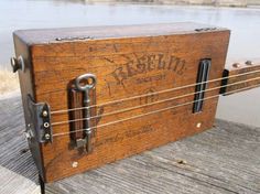 an old wooden box sitting on top of a dock