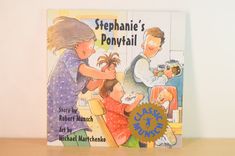 a children's book about stephanie's pony tail is sitting on a table