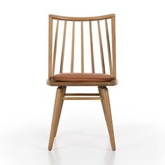 a wooden chair with a brown seat and back cushion on the side, in front of a white background