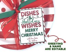 a red and white plate with a green ribbon on it that says dishes and holiday wishes merry christmas