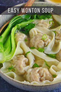 a bowl of wonton soup with broccoli and noodles