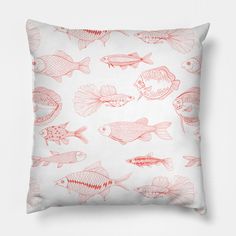 a white pillow with red fish on it