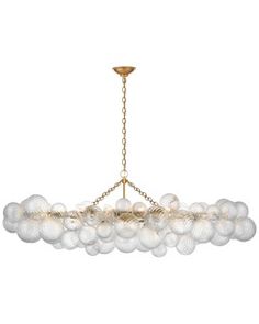 a large chandelier with many balls hanging from it's center point, on a white background