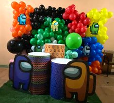 an arrangement of balloons and cups are on display