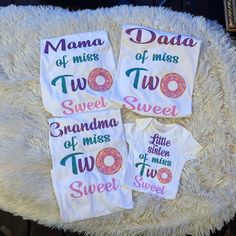 three t - shirts with donuts on them sitting on a fluffy white chair cushion