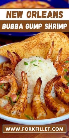 a bowl filled with shrimp and rice on top of a table