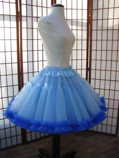 "This listing is for a custom order for a super-full double layer nylon organdy petticoat with satin waist and chiffon bottom ruffles. The pictured petticoat was designed for a 26.5\" (67,3 cm) waist and is 20\" (50,8 cm) long. It is displayed on a dress form with a 22\" (55cm) waist. You can choose any length you need. I will lengthen each of the tiers to achieve extra length. If you would prefer that I add another tier to achieve extra length, then the price will increase substantially. If you Sheer Fitted Petticoat For Party, Fitted Sheer Petticoat For Wedding, Fitted Organza Petticoat With Ruffles, Fitted Vintage Tulle Petticoat, Fitted Blue Tulle Petticoat, Blue Fitted Tulle Petticoat, Fitted Tulle Petticoat With Ruffles, Blue Fitted Petticoat For Party, Fitted Spring Organza Petticoat