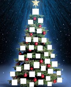 a christmas tree with white squares and red balls on it in front of a star