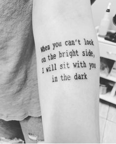 a person with a tattoo that reads, when you can't look on the bright side, i will sit with you in the dark