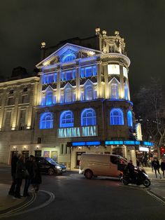 the building has blue lights on it's windows