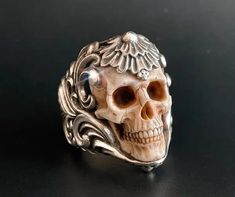 🔱This ring is a unique ring inspired by medieval armor and wild animal skulls. Its distinctive and fashionable appearance, coupled with a strong sense of antiquity, has been highly sought after by jewelry enthusiasts. 🔱The super realistic skull carved from top quality deer antler of high density embedded in an intricate floral ornament silver ring band makes this piece an absolute eye-catcher. 🔱The antler skull has been crafted with anatomical correctness to resemble a miniature real human sk Floral Armor, Realistic Skull, Silver Ring Band, Floral Ornament, Medieval Armor, Deer Antler, Animal Skulls, Unique Ring, Skull Ring