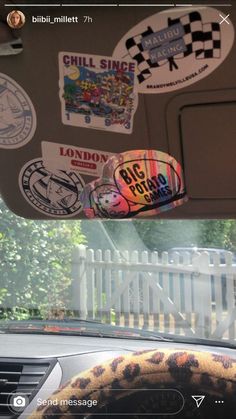 the interior of a car with stickers on it