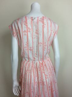 peachy pink & white fleur-di-lis & stripe patterned day dress cap sleeves & pleated skirt 'R&K Originals' no fabric tag, most likely a polyester blend crepe fabric no size tag, fits modern medium 42 inch bust, 32 inch waist, open hip measurement 41 1/2 inch length, 25 inch skirt 21 inch covered back zipper lined bodice front great condition, no marks or flaws visible Vintage Striped Summer Dresses, Summer Vintage A-line Pleated Dress, Vintage Cap Sleeve Dresses, Vintage Striped Dresses For Daywear, Pleated Striped Dresses For Spring, Spring Cap Sleeve Dress With Pleated Waist, Pink Fitted Casual Vintage Dress, Vintage Striped Fitted Dress, Vintage Short Sleeve Striped Dress