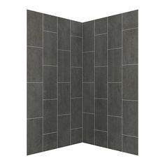 an open shower stall with grey tile walls