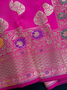 Beautiful Pink color Banarasi Handloom Saree with Gold Zari Weaving Buttas and floral borders with Meenakari Work. The pallu of the saree is grand and with Meenakari Work. Material is very soft and easy to drape and carry. Item : SareeColor : PinkBase Fabric : Soft Banarasi Silk Blouse piece : Comes with Blouse pieceBlouse material : Soft Banarasi Silk Fall & Edging: Comes with Fall and edging (Pico) and tassels attached Occasion: Party, Wedding, Festival, Wedding, Traditional, Religious, House- Floral Borders, Bandhani Saree, Kanjivaram Sarees, Readymade Blouse, Kantha Stitch, Blouse Material, Soft Silk Sarees, Festival Wedding, Banarasi Sarees