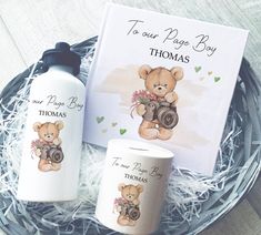 two personalized items are sitting in a basket next to a greeting card and coffee mug