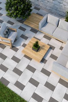 an aerial view of a patio with couches and tables