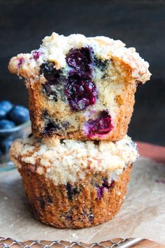 two blueberry muffins stacked on top of each other