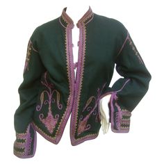 Exotic embroidered green wool jacket c 1970s The unique wool hunter green jacket is embellished with intricate lavender embroidery and applique detail The borders are framed with applique embroidery. The jacket secures with tiny round knit lavender button closures The sinuous embroidery extends to the shoulders, cuffs and back side. The cuffs can be folded up to reveal the lavender taffeta fabric underneath The interior is lined in burgundy felt wool No size label refer to measurements The lengt Hunter Green Jacket, Lavender Embroidery, 1970s Jacket, Boiled Wool Jacket, Taffeta Fabric, Felt Wool, Embroidered Wool, Boiled Wool, Green Wool