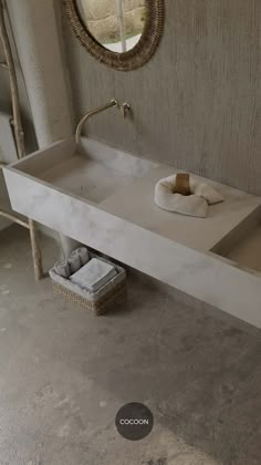 a bathroom sink sitting under a mirror next to a window