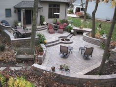 an outdoor patio with seating and fire pit