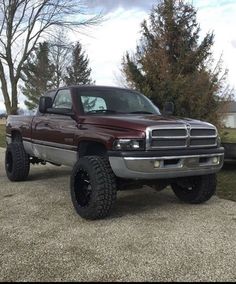 a large truck parked on top of a gravel road