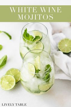 white wine mojitos in glasses with limes and mint garnishes