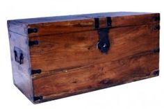 an old wooden chest with metal handles